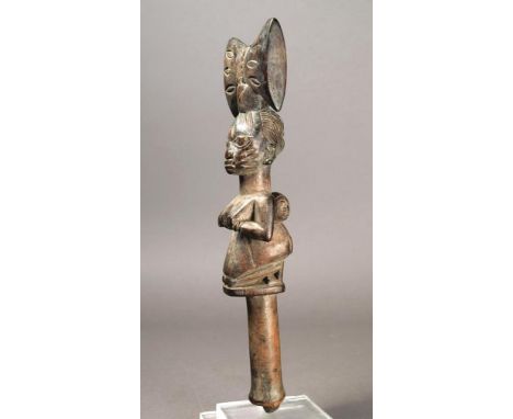 A Yoruba Shango wand Nigeria wood, the kneeling mother holding her breasts and with a child on her back, with elliptical scar