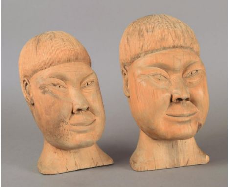 Jens Sikkumsen South Greenland wood, a pair of portrait busts, signed with initials J.S., circa 1950, 17.5cm and 20cm high. (