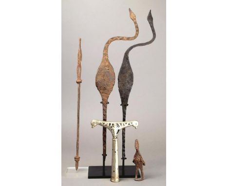 Two Mumuye ingot currency Nigeria iron with bent necks and bird like heads, 38cm and 38.5cm high, mounted, a Nigerian white m
