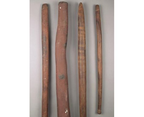 Three Aboriginal clubs Australia wood, including one with an incised handle and ends, 68cm long, one with pointed ends and re