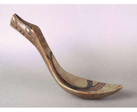 A Tlingit feast ladle Northwest Coast, British Columbia wood with polychrome decoration, with an elliptical bowl and a raven'