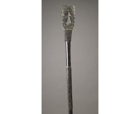 A Massim staff Trobriand Islands, Papua New Guinea wood, carved and pierced with a double figure finial and scroll decoration