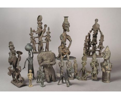 A collection of West African brass figures including a drummer with a conical headdress, 22.5cm high, a pair of groups and a 