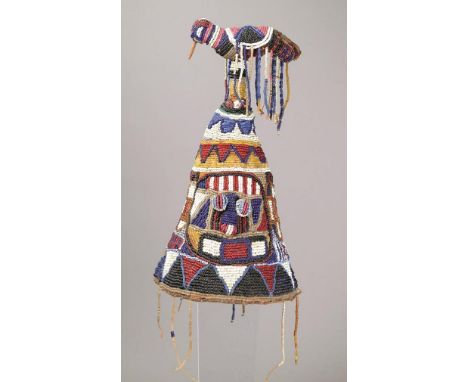 A Yoruba beaded crown Nigeria beads, cloth, wood and fibre, decorated with two masks and with a detachable bird finial, 27cm 