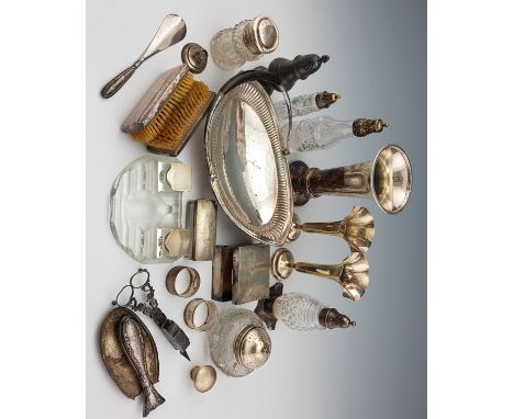 A collection of hallmarked silverware to include, vases, a cigarette box, napkin rings, a glass inkwell, various dressing tab