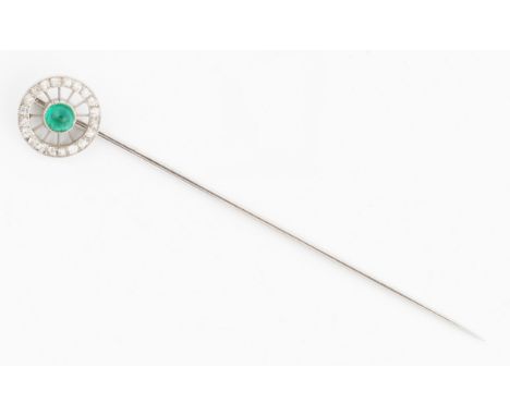 A French emerald and diamond stick pin, the wheel design set centrally with an emerald cabochon, surrounded by a circular bor