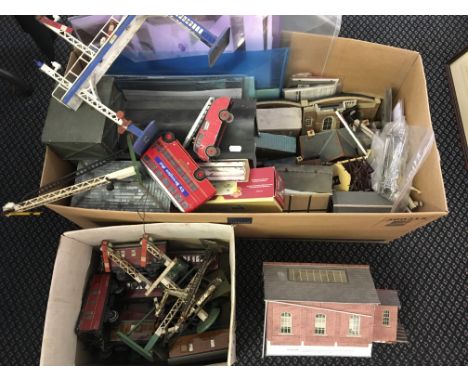 A selection of model cranes, train carriages, other vehicles, stations, etc.