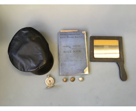 A Great Western Railway 1936 rule book, two GWR buttons, a London Midland and Scottish Railway Company badge, US compass, a p