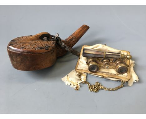 A pair of Duvelleroy Paris purple mother of pearl opera glasses in bag with a carved wood Moroccan style powder flask.