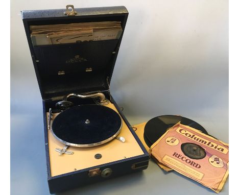 A Salon Decca 10 blue gramaphone with a selection of various records.