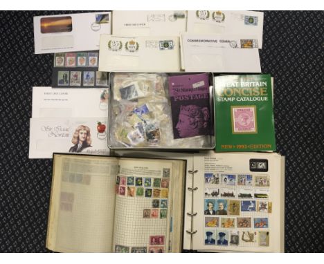 Two books of stamps, first day covers, loose stamps and a stamp catalogue.