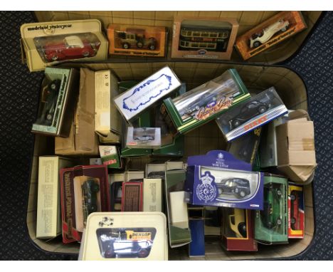 A case of various diecast model vehicles, in boxes.