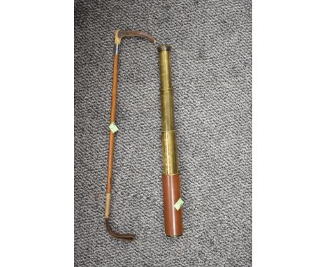A vintage Britannic four draw brass cased telescope with riding crop