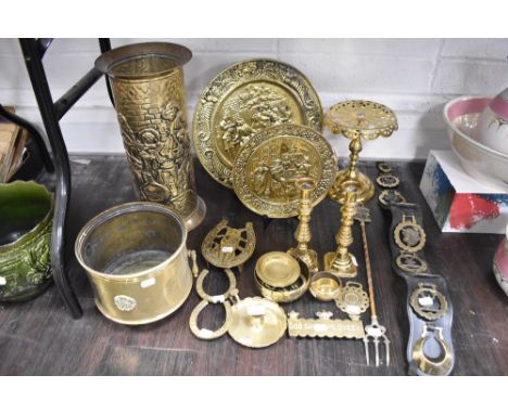 A selection of brass wares including stick stand, candle sticks, trivet and plates etc