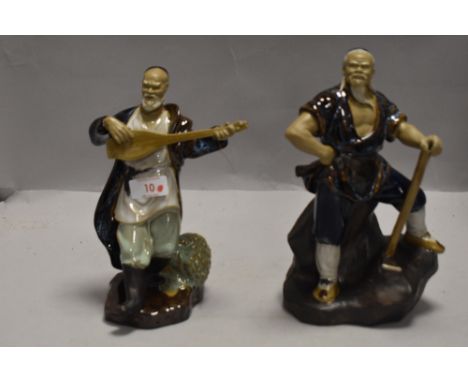 Two 20th century Chinese Mudmen figures one playing guitar and another holding axe