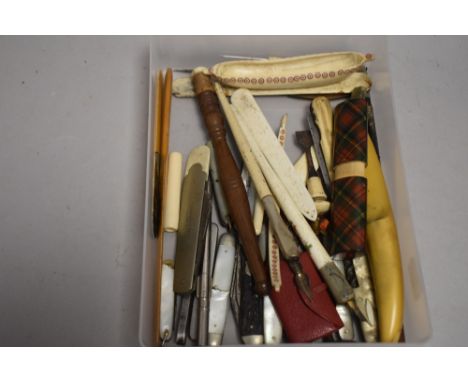 A selection of pocket and pen knives including advertising and mother of pearl etc