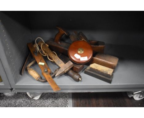 A selection of woodworking or joiners tools including large draw knife