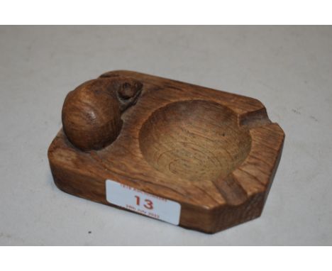 A Robert Thompson Mouseman oak carved ashtray, with carved mouse signature