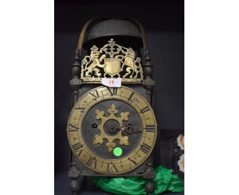 An 18th century and later lantern clock of large proportions having single hand fusee mechanism with brass and iron case and 