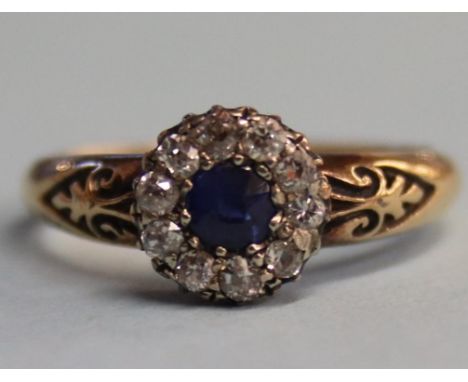 An 18ct gold diamond and sapphire ring, 3.8g, size 'P'