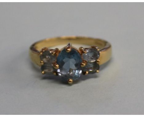 A 9ct gold five stone aquamarine ring, size 'P'