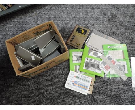 A box of 00 gauge including Triang plastic platforms, Metcalfe card kits, The Model Railway Handbook etc