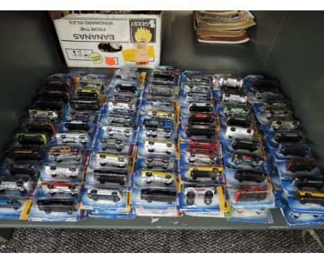 A shelf containing 140 Mattel Hot Wheels diecasts all in blister card packs including 2008 40 year anniversary editions