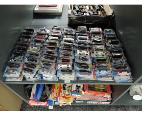 A shelf containing 140 Mattel Hot Wheels diecasts all in blister card packs including 2008 40 year anniversary editions