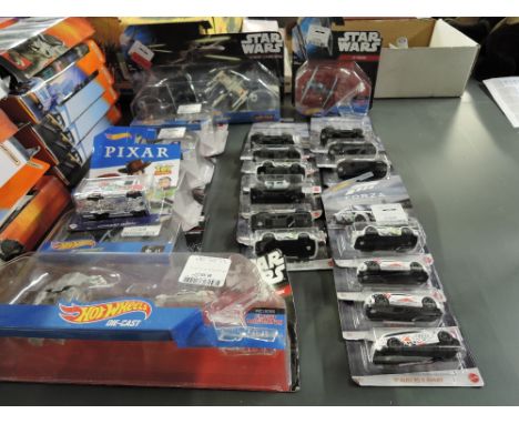 A collection of Twenty Two modern Mattel Hot Wheels diecasts, all in blister packs including Star Wars, Forza and Toy Story
