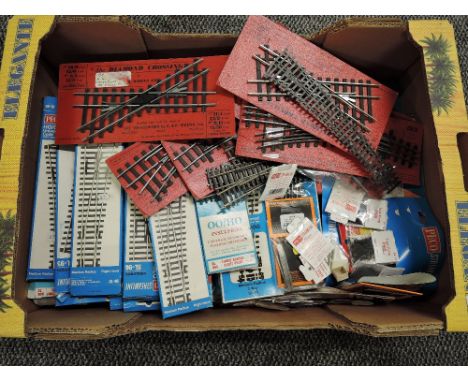 A box containing Forty Sets of 00 Points, 35 Peco, 2 Hornby Dublo and 3 Roco includes Triples, 4-Way and Crossings along with