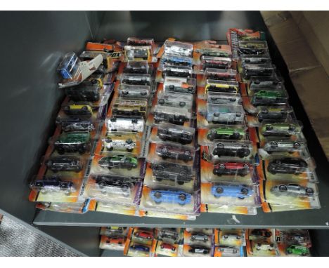 A shelf of modern Matcbox diecasts, all in blister packs, 100 in total