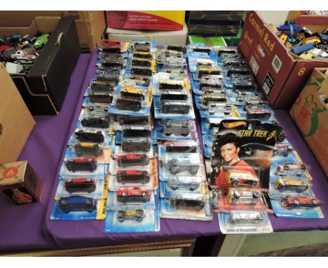 A collection of Mattel Hot Wheels diecasts all in blister card packs including Star Trek 50th Anniversary, 80 in total