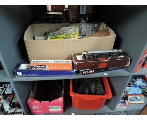 Two shelves of 00 gauge including four Lima &amp; Hornby Locomotives, three boxed, a box of accessories and two boxes of trac