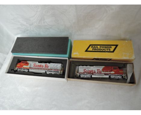 A Ajin Overland Models Inc HO scale American Brass Santa Fe Locomotive 834 and a Rail Power Products HO scale plastic Santa F