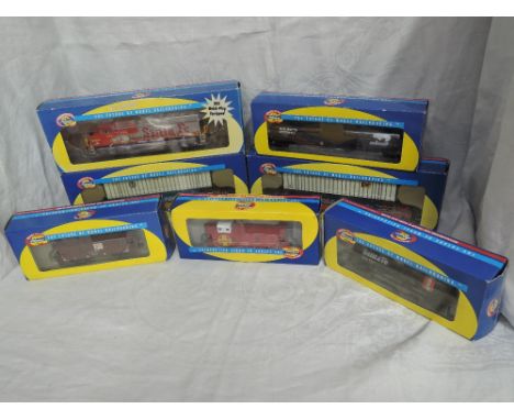 Seven Athearn HO scale, ATSF War Bonnet Locomotive 142, boxed 91502, Husky Stack x2, boxed 7264 &amp; 7265, Tank Car, boxed 7