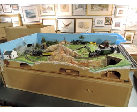 A N gauge Layout in a box contains 4 Bachmann and similar Loco's, Coaches and Wagons