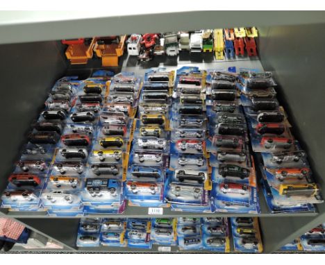 A shelf containing 140 Mattel Hot Wheels diecasts all in blister card packs including 2008 40 year anniversary editions