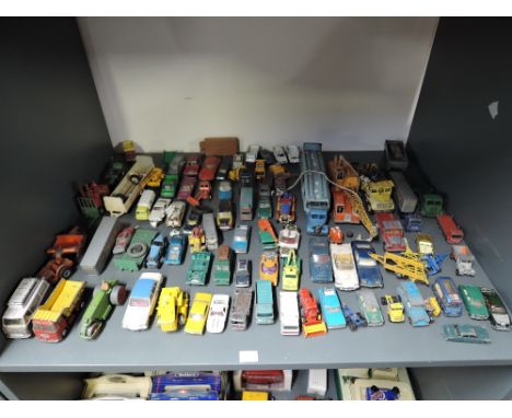 A shelf of playworn diecasts including Matchbox Lesney, Corgi, Dinky etc