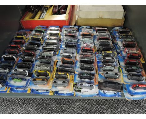 A shelf containing 140 Mattel Hot Wheels diecasts all in blister card packs including 2008 40 year anniversary editions