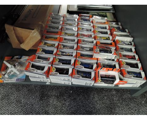 A shelf of modern Matchbox Mattel Wheels diecasts, including 50th Anniversary and Hero City, approx 100 all in window boxes