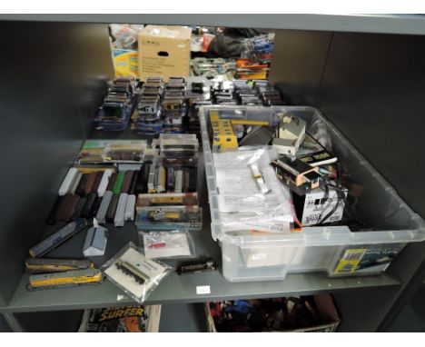 A shelf of N gauge including three Kato (Japan) Union Pacific and CSX Locomotives, a similar Union Pacific Locomotive, Fourte