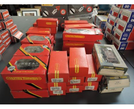 A large collection of 42 Hornby 00 gauge items of rolling stock including Closed Van Cadburys R109 x3, Flat Wagon R131 x3, Mi