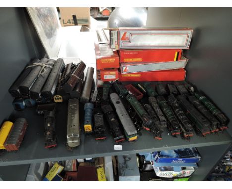 A shelf of 00 gauge Locomotives, Locos &amp; Tenders, Rolling Stock etc including Lima, Hornby, Triang, Mainline and similar,