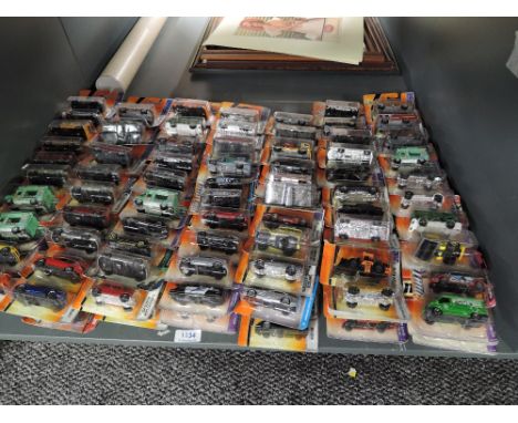 A shelf of modern Matcbox diecasts, all in blister packs, 140 in total
