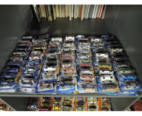 A shelf of modern Mattel and similar Hot Wheels diecasts, all in blister packs, 140 in total