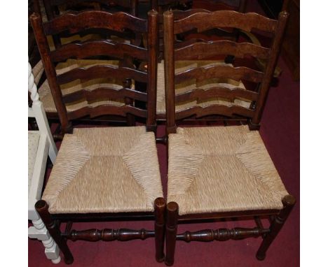 A set of ten Lancashire style oak ladderback rush seat dining chairs (8+2)Condition report: All chairs are good and strong.Wi