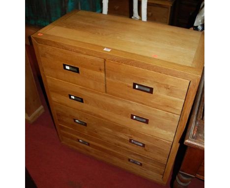 A contemporary light oak chest of two short over three long drawers, width 86cm
