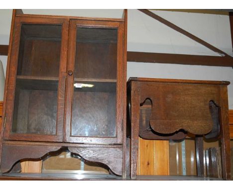 A small 1930s double door glazed bookcase, w.60cm; together with a provincial oak hinge topped commode (2)