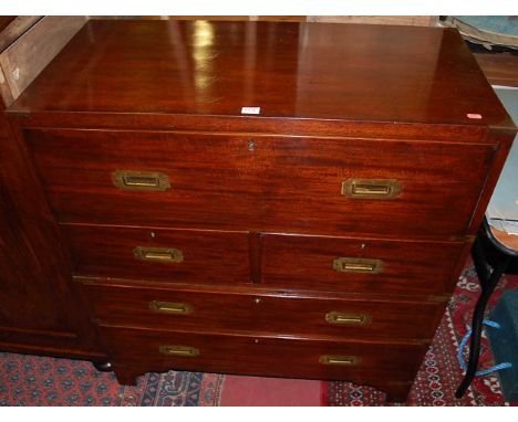 A mahogany and brass bound campaign secretaire chest, comprised of two sections, with interior inset writing surface over two