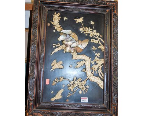 A Japanese Meiji period bone and mother of pearl shibyama panel, depicting bird of prey amidst flowering bamboo (some losses)